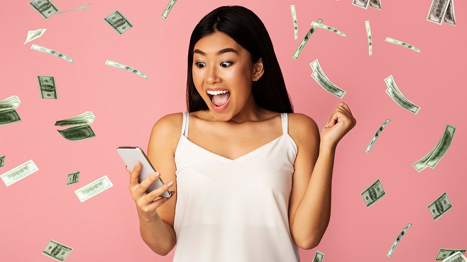 Person with excited expression surrounded by falling money